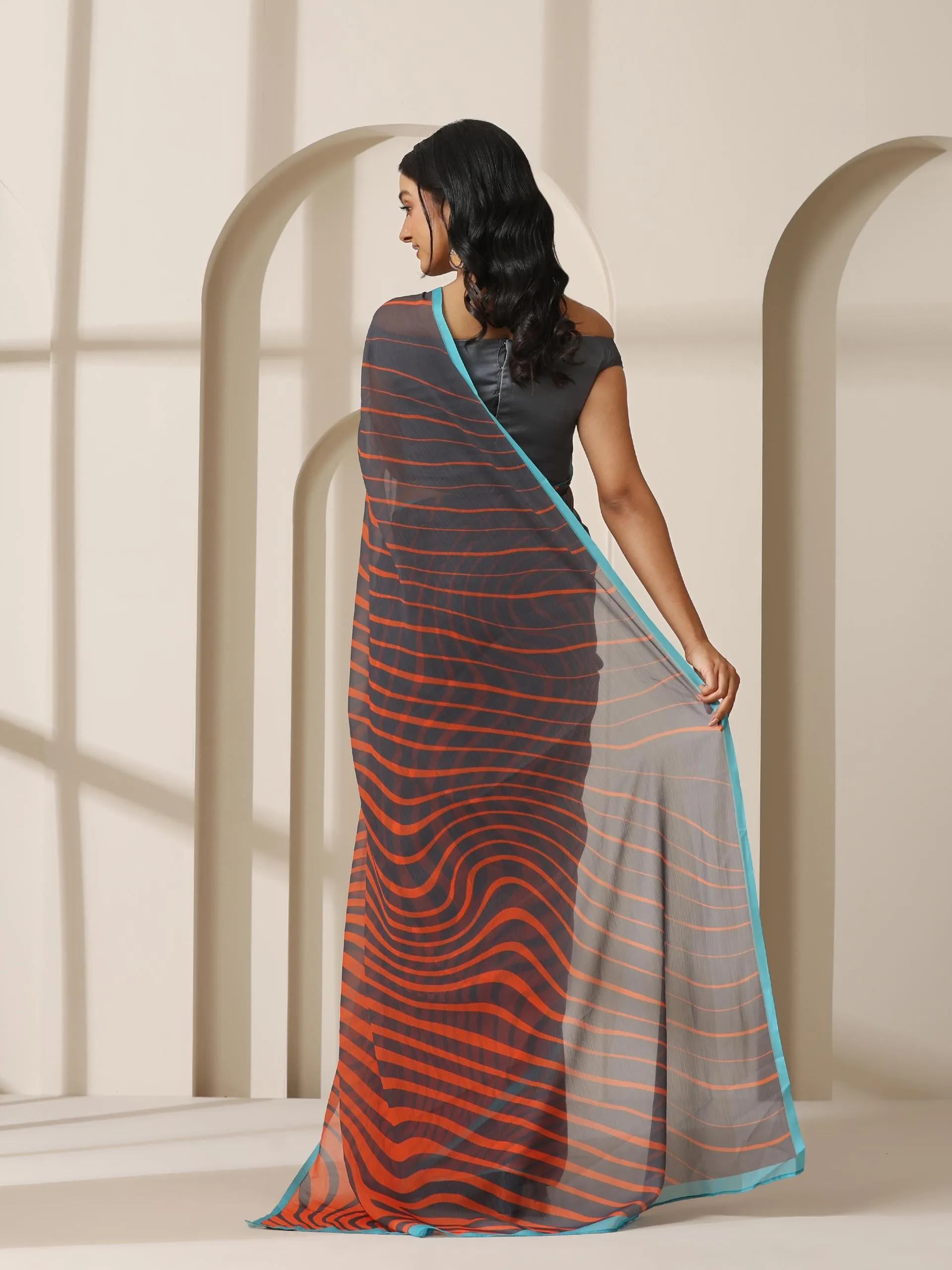 Lava Orange Waves Chiffon Print Saree with Blue Border & Grey Blouse Fabric