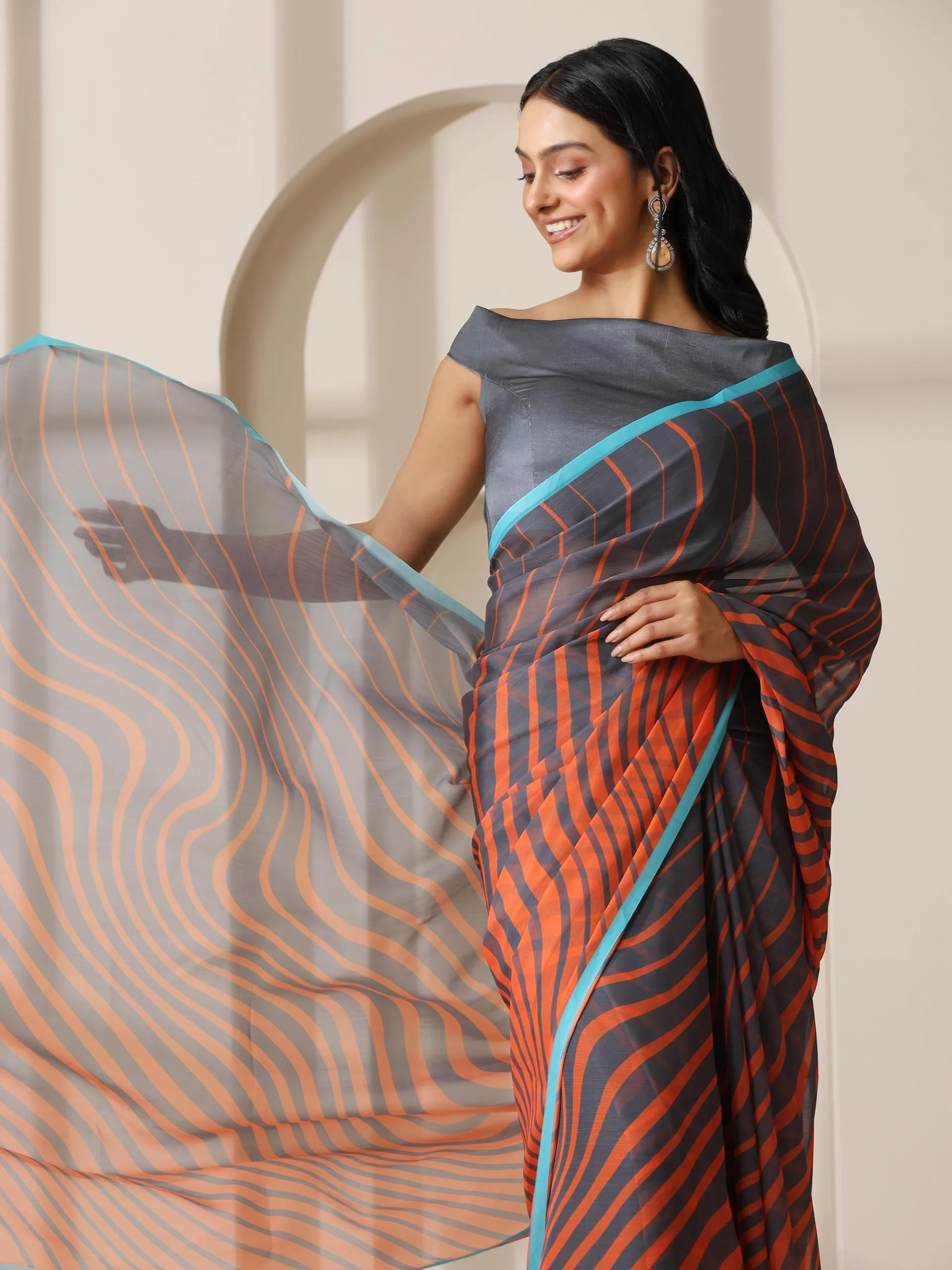 Lava Orange Waves Chiffon Print Saree with Blue Border & Grey Blouse Fabric