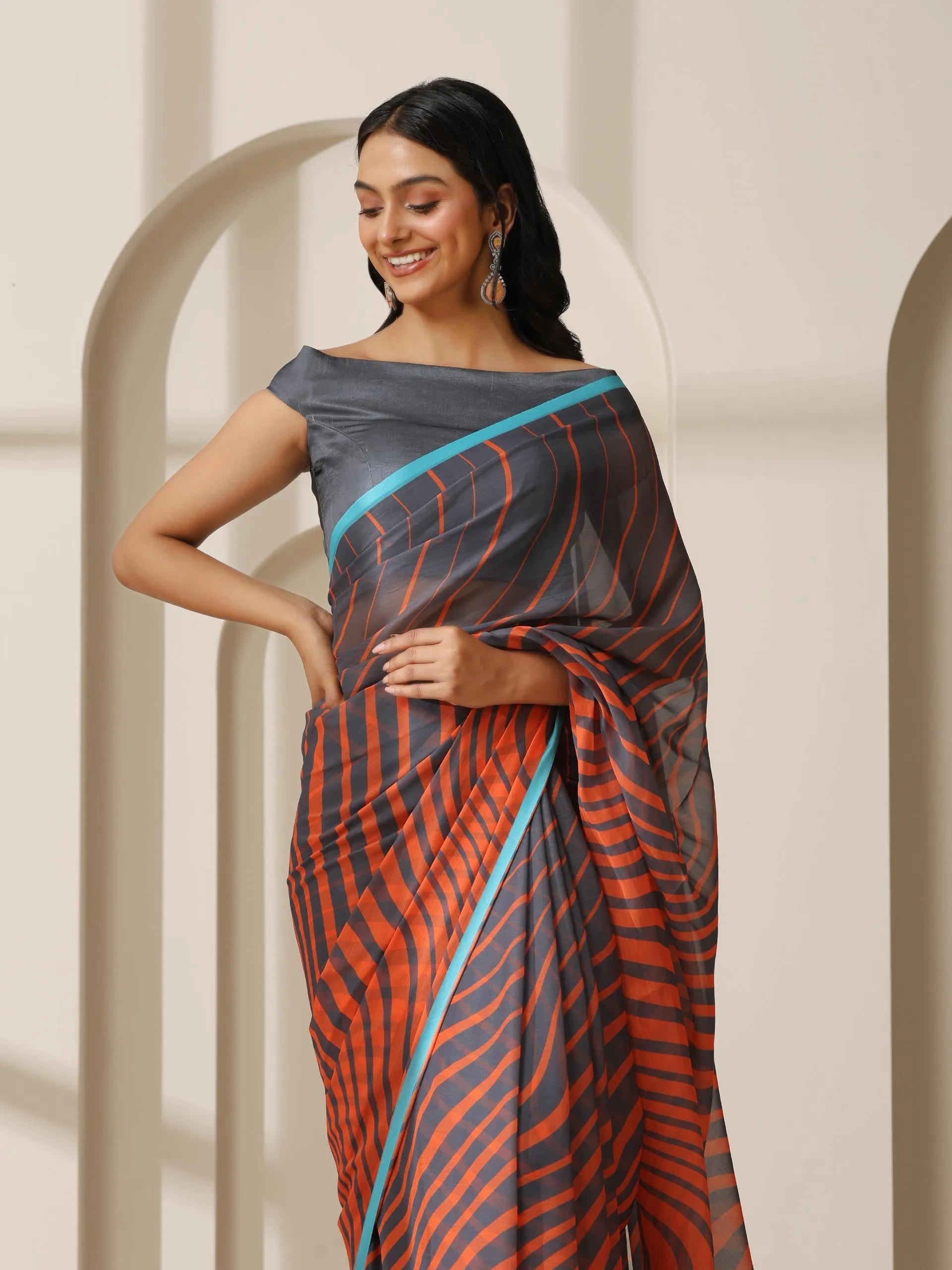 Lava Orange Waves Chiffon Print Saree with Blue Border & Grey Blouse Fabric