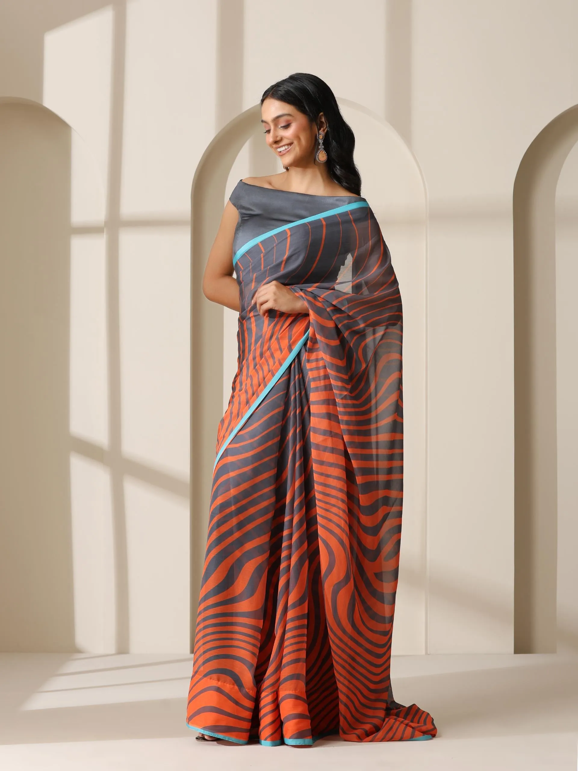 Lava Orange Waves Chiffon Print Saree with Blue Border & Grey Blouse Fabric